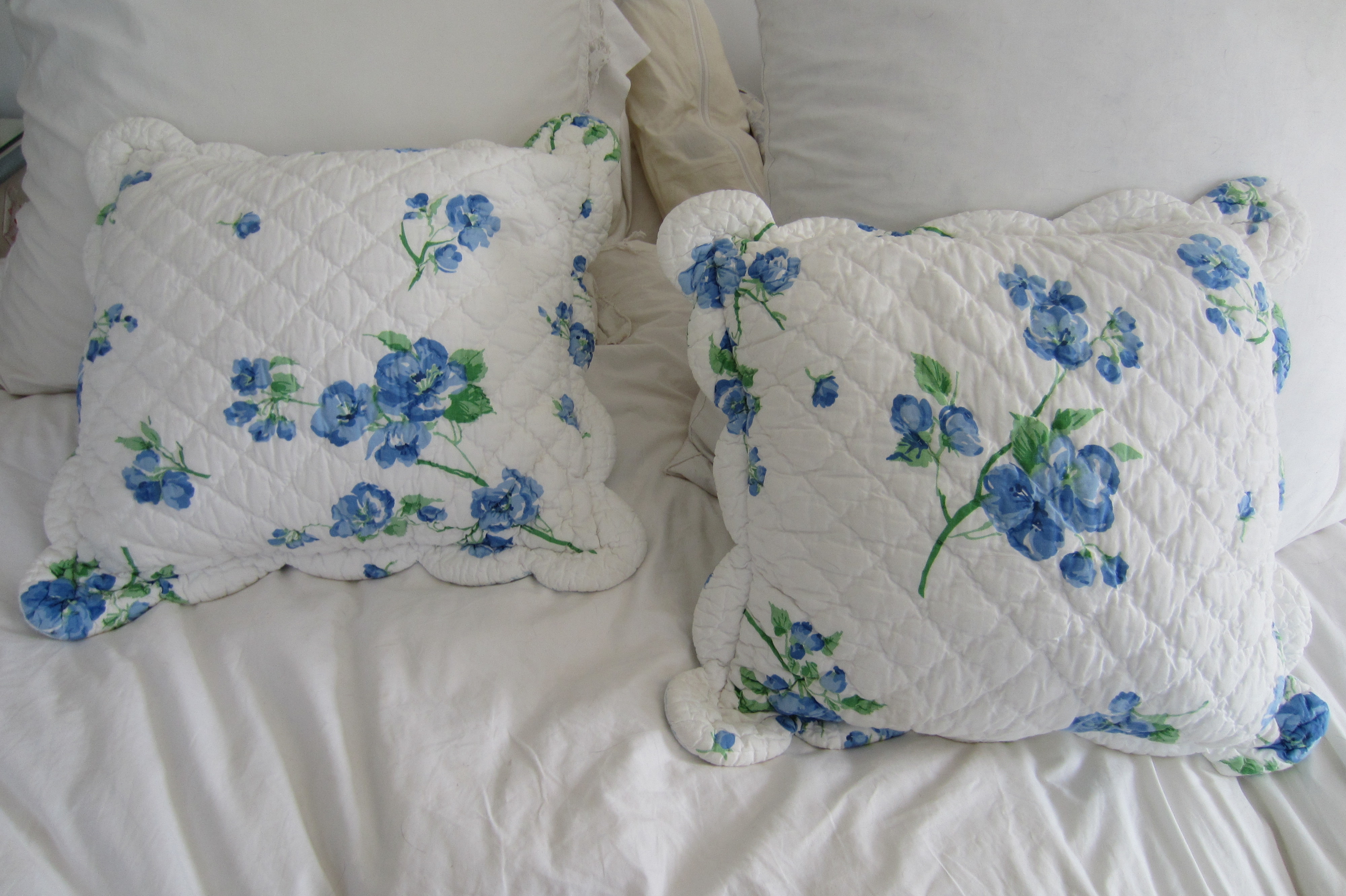 Throw pillows with freshly-washed quilted covers
