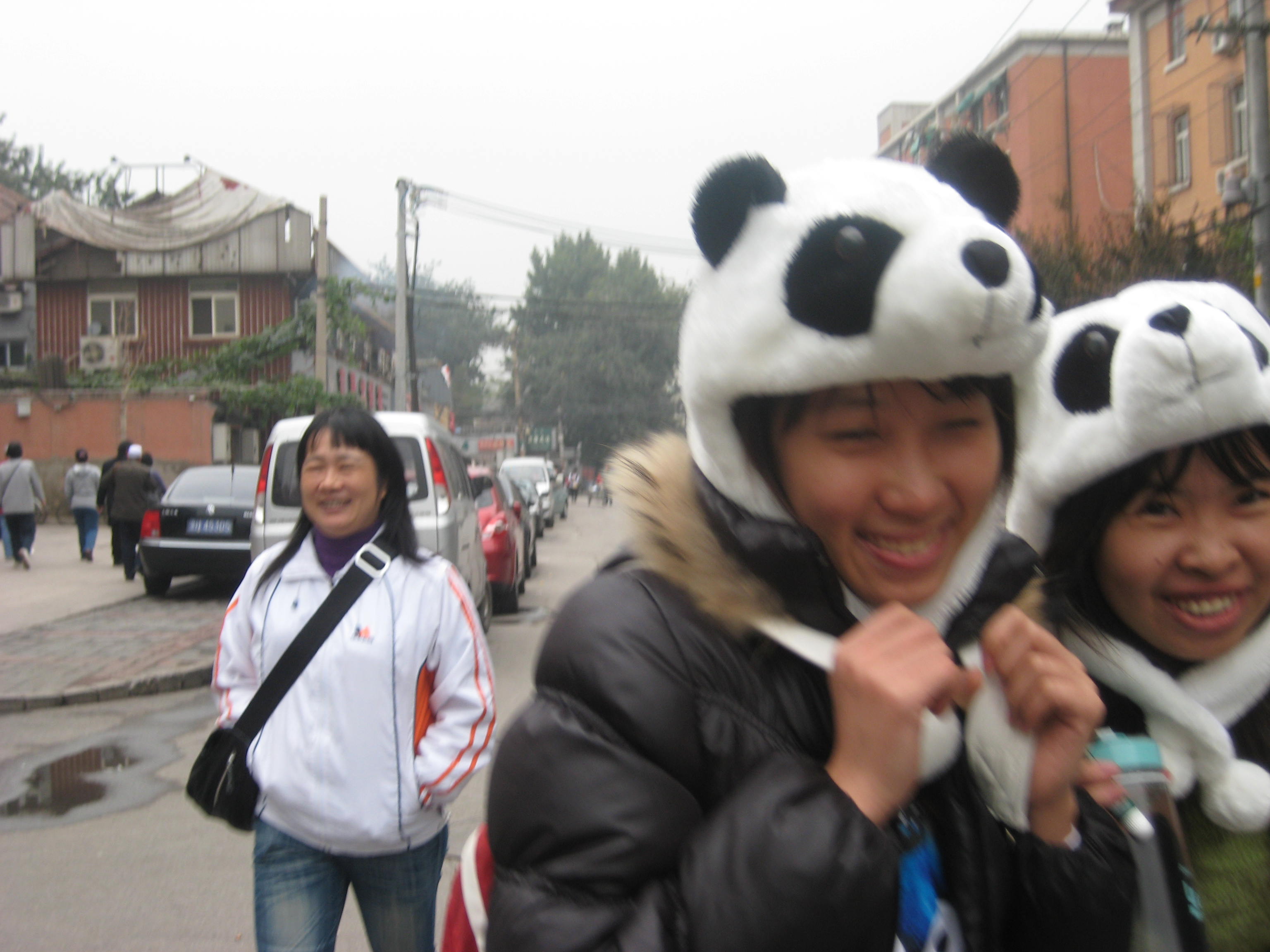 giggly girls in panda hats