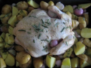 Passover chicken with potatoes, shallots and rosemary ready for the oven