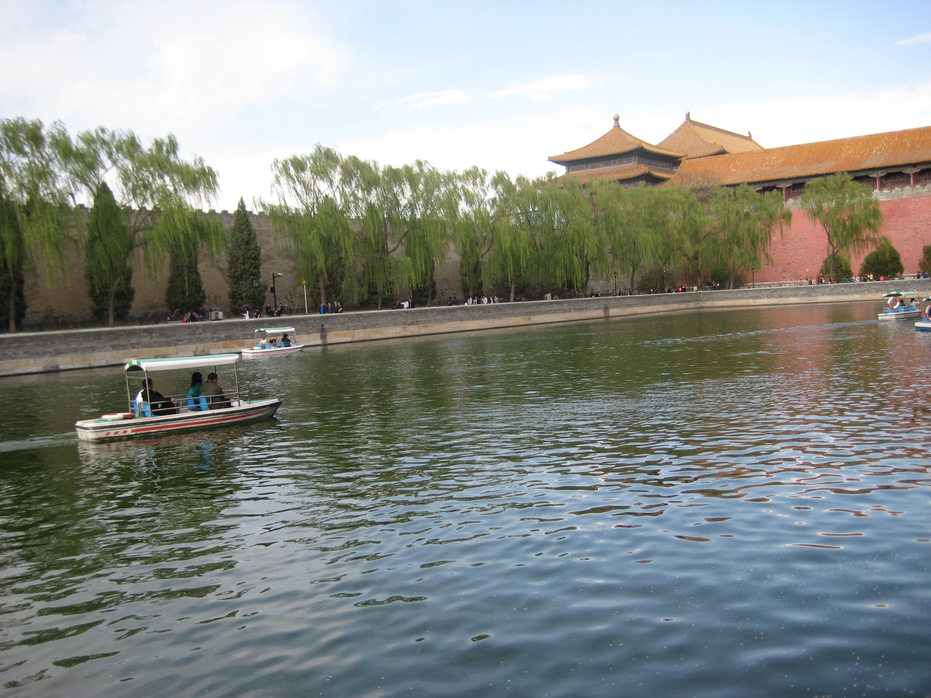 Lucky couples who've found their matches enjoy a sunny day on the moat of The Forbidden City