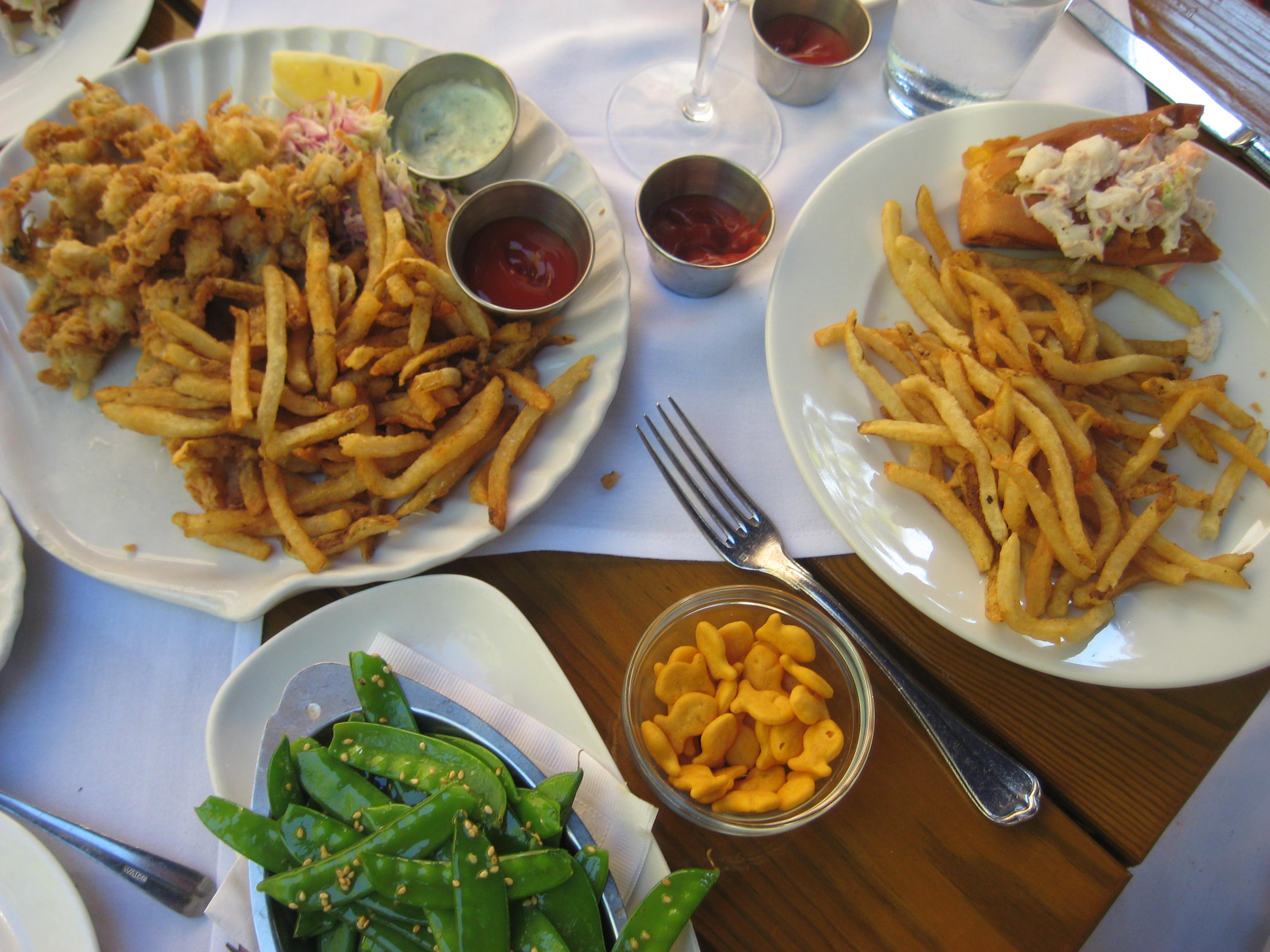 Fried clams, lobster roll, french fries, pea pods